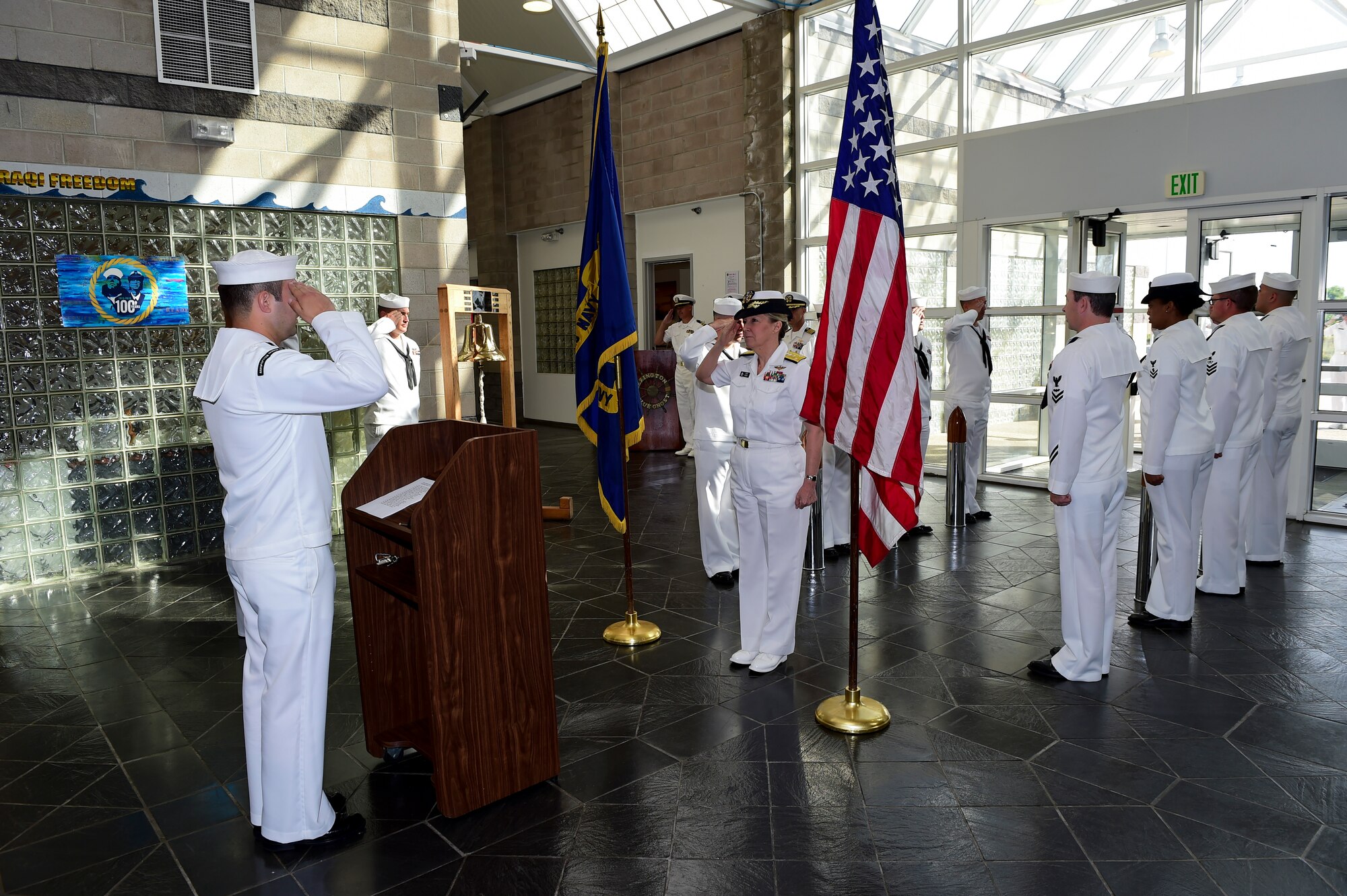Members of the Navy Operations Support Center, Denver, ring aboard Vice Adm. Robin R. Braun, Chief of Navy Reserve and Commander, Navy Reserve Force July 19, 2015, on Buckley Air Force Base, Colo. This visit was held as part of the yearlong celebration by the Navy Reserve Corps to celebrate their 100th anniversary.  (U.S. Air Force photo by Senior Airman Phillip Houk/Released)