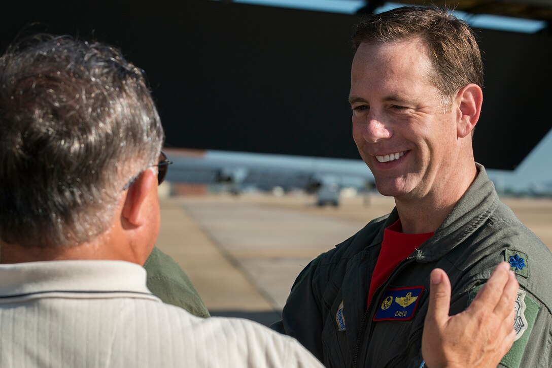 U.S. Air Force Lt. Col. Chris Anderson, 307th Operations Support Squadron commander, talks with a member of the Experimental Aircraft Association Chapter 343 before boarding a 307th Bomb Wing B-52H Stratofortress to leave in support of the EAA AirVenture Oshkosh Air Show, July 17, 2015, Barksdale Air Force Base, La. The air show is an annual event held at the Wittman Regional Airport in Oshkosh, Wis., and although B-52s have supported past air shows with a fly-by, this will be the first time a B-52 will land and sit as a static display. (U.S. Air Force photo by Master Sgt. Greg Steele/Released)