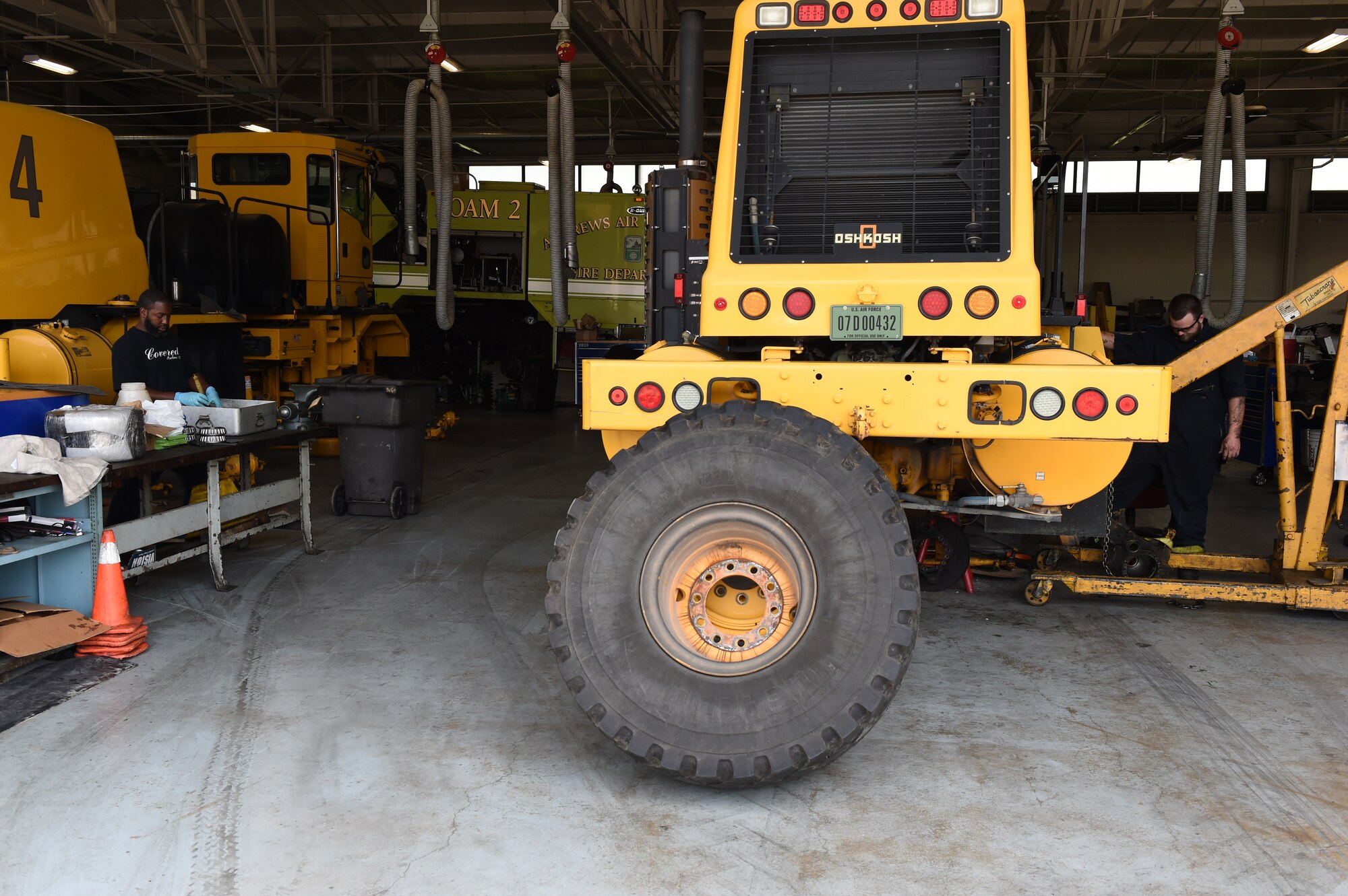 11th Logistics Readiness Squadron mechanics dismantle and clean a snow plow vehicle as part of the snow fleet rebuild at Joint Base Andrews, Md., July 21, 2015. LRS Airmen ensure the snow fleet is ready for use before the winter season comes. (U.S. Air Force photo/Senior Airman Joshua R. M. Dewberry)