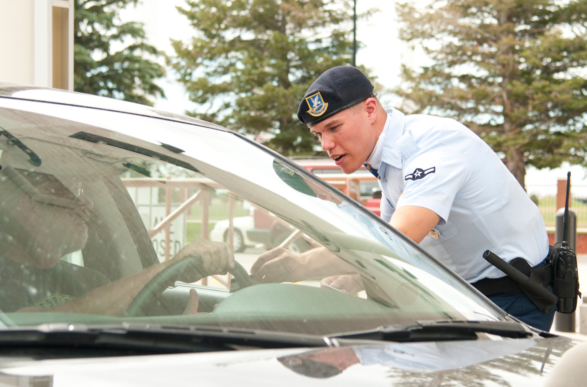 Airman Jeffrey Zembriski, 90th Security Forces Squadron entry controller, conducts an ID check on F.E. Warren Air Force Base, Wyo., July 19, 2015, for Fort D.A. Russell Days, the base’s annual open house. The 90th Security Forces Group provided security throughout using a variety of tactics, techniques and procedures. All adult guests entering the base for the open house were required to have photo ID.. (U.S. Air Force photo by Senior Airman Jason Wiese)