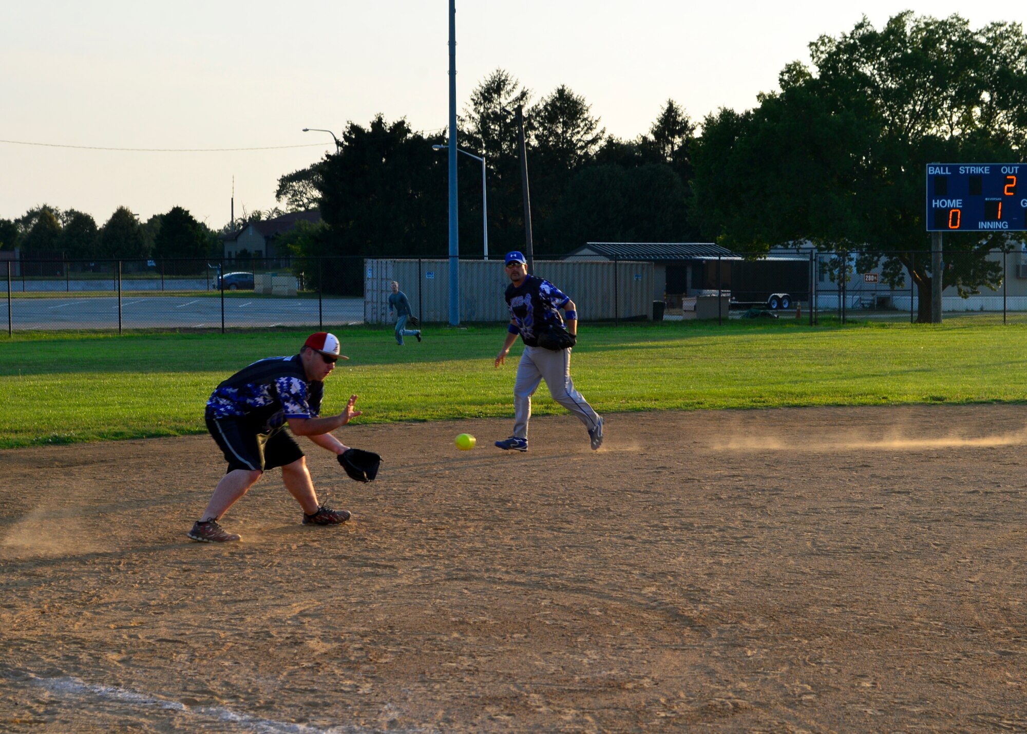 Brandon Shelton, 436th Security Force Squadron third baseman, fields a line drive during an intramural softball game against the 436th Maintenance Squadron July 20, 2015, at the softball field on Dover Air Force Base, Del. The 436th SFS are the defending softball champions and are looking to repeat with another championship run this season. (U.S. Air Force photo/Airman 1st Class William Johnson)