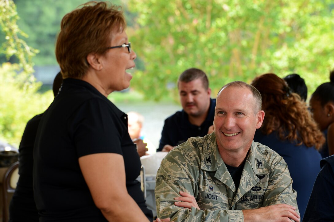 U.S. Air Force Col. Stephen Jost, 20th Fighter Wing commander, converses with an AbilityOne employee during the AbilityOne Employee Appreciation Picnic held at Memorial Lake at Shaw Air Force Base, S.C., July 17, 2015. The ceremony is an Air Force level recognition to honor and recognize the disabled employees on base that make the mission possible.