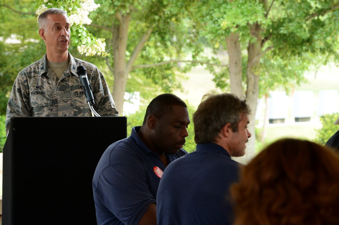 U.S. Air Force Col. John Thomas, 20th Mission Support Group commander, delivers opening remarks at the AbilityOne Employee Appreciation Picnic held at Memorial Lake at Shaw Air Force Base, S.C., July 17, 2015. The AbilityOne program gives disabled people viable employment opportunities. (U.S. Air Force photo by Senior Airman Jonathan Bass/Released)