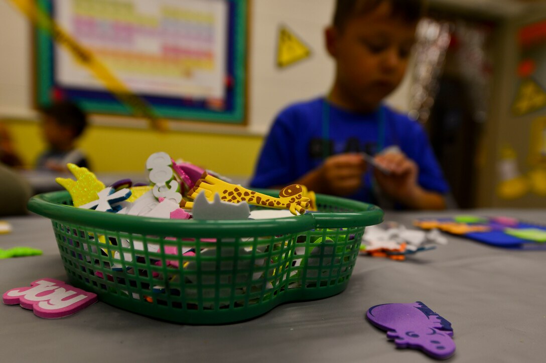 Regimental Chapel Vacation Bible School students make crafts at the chapel on Fort Eustis, Va., July 14, 2015.  This year VBS, which is open to all denominations, focused on how science and religion relate through crafts, activities and classroom lessons. (U.S. Air Force photo Staff Sgt. Natasha Stannard/Released)

