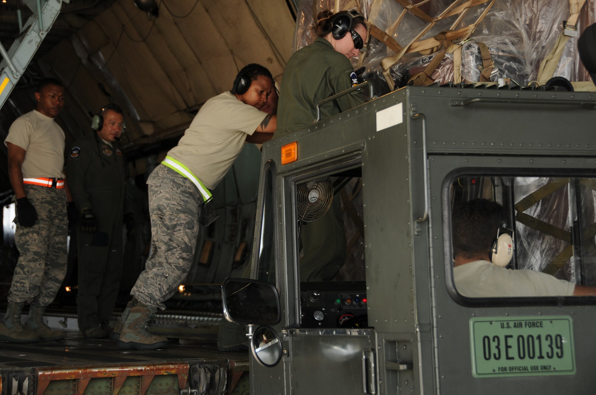 Airmen from the 69th Aerial Port Squadron loaded a C-5 aircraft from the 433 Airlift Wing from San Antonio, Texas.  The scenario entailed training real-world purposes.  This rare event occurred on June 7, 2015. (US Air Force Photo / Maj. Tim Smith)