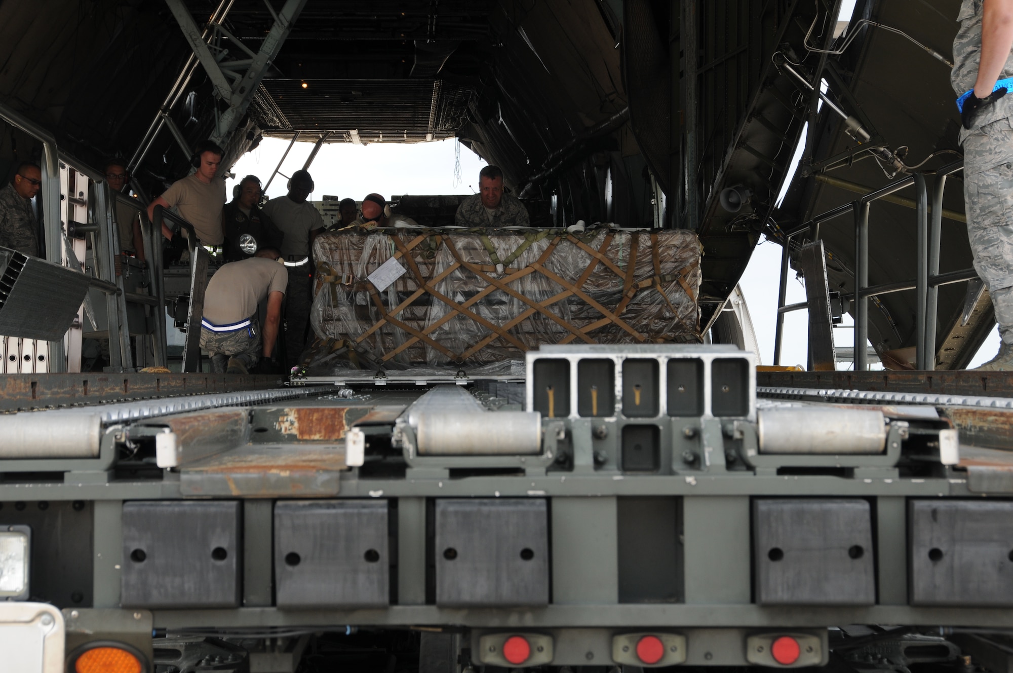 Airmen from the 69th Aerial Port Squadron loaded a C-5 aircraft from the 433 Airlift Wing from San Antonio, Texas.  The scenario entailed training real-world purposes.  This rare event occurred on June 7, 2015. (US Air Force Photo / Maj. Tim Smith)
