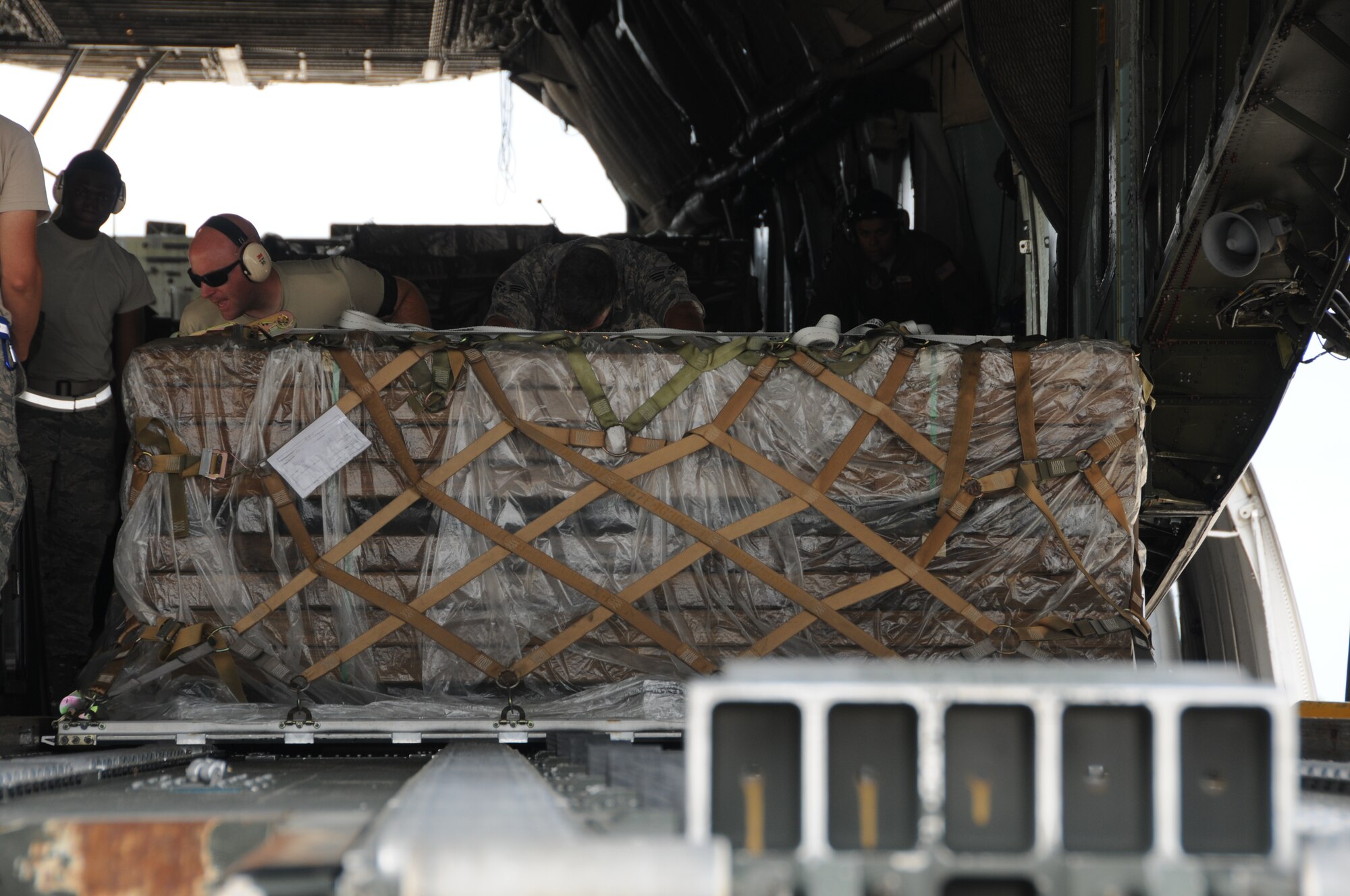 Airmen from the 69th Aerial Port Squadron loaded a C-5 aircraft from the 433 Airlift Wing from San Antonio, Texas.  The scenario entailed training real-world purposes.  This rare event occurred on June 7, 2015. (US Air Force Photo / Maj. Tim Smith)