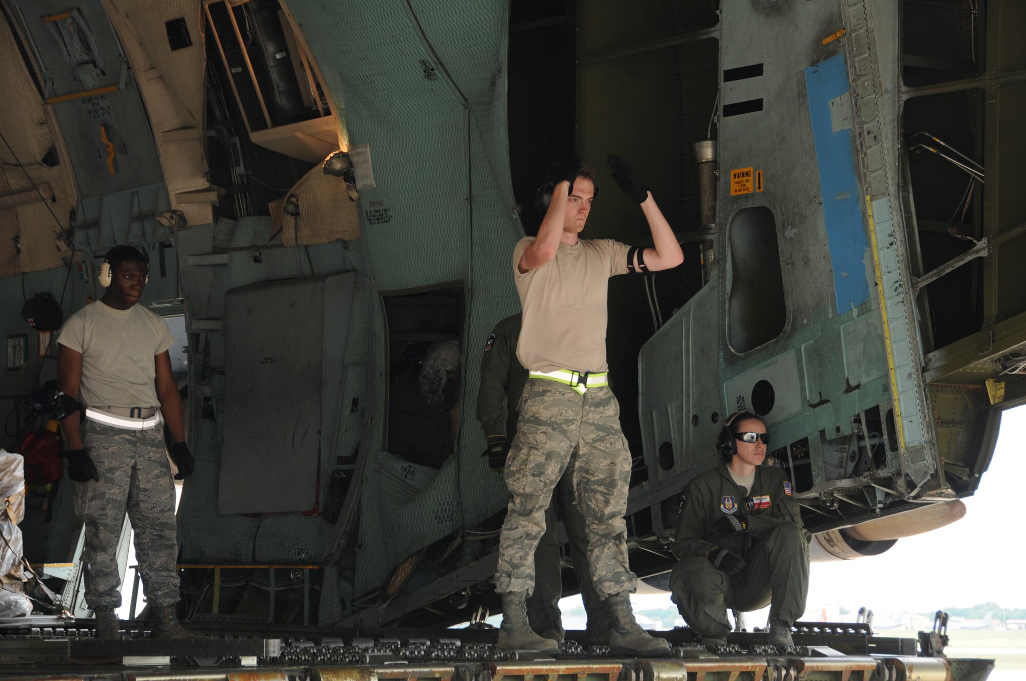 Airmen from the 69th Aerial Port Squadron loaded a C-5 aircraft from the 433 Airlift Wing from San Antonio, Texas.  The scenario entailed training real-world purposes.  This rare event occurred on June 7, 2015. (US Air Force Photo / Maj. Tim Smith)