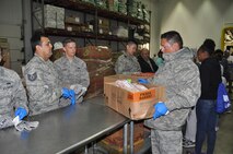 Nearly a dozen 433rd Airlift Wing members from the Aircraft Maintenance Squadron at Joint Base San Antonio-Lackland, Texas separated food items for distribution to local needy families on July 18, 2015, during their block training. The San Antonio Food Bank distributes food items to 16 area food pantries in the South Texas area. (U.S. Air Force photo/Capt. Cris Medina)