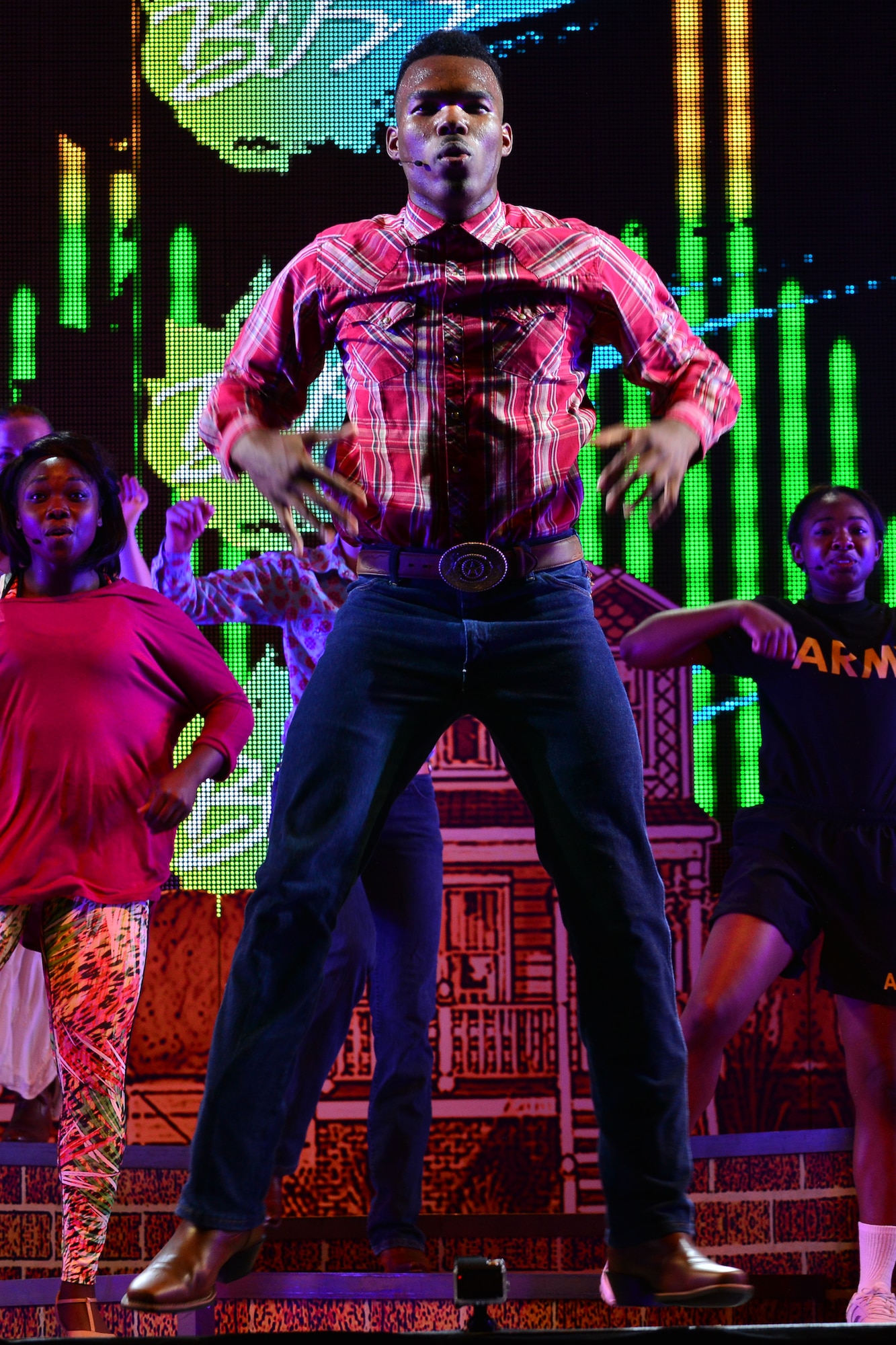 U.S. Army Spc. Brandel Diggs, U.S. Army Morale, Welfare and Recreation Programs Soldier Show performer, dances during a performance at Fort Eustis, Va., July 15, 2015. The Soldier Show’s mission is to deliver quality performances supporting the readiness and resiliency of the U.S. Army and its Soldiers. (U.S. Air Force photo by Staff Sgt. Natasha Stannard/Released)