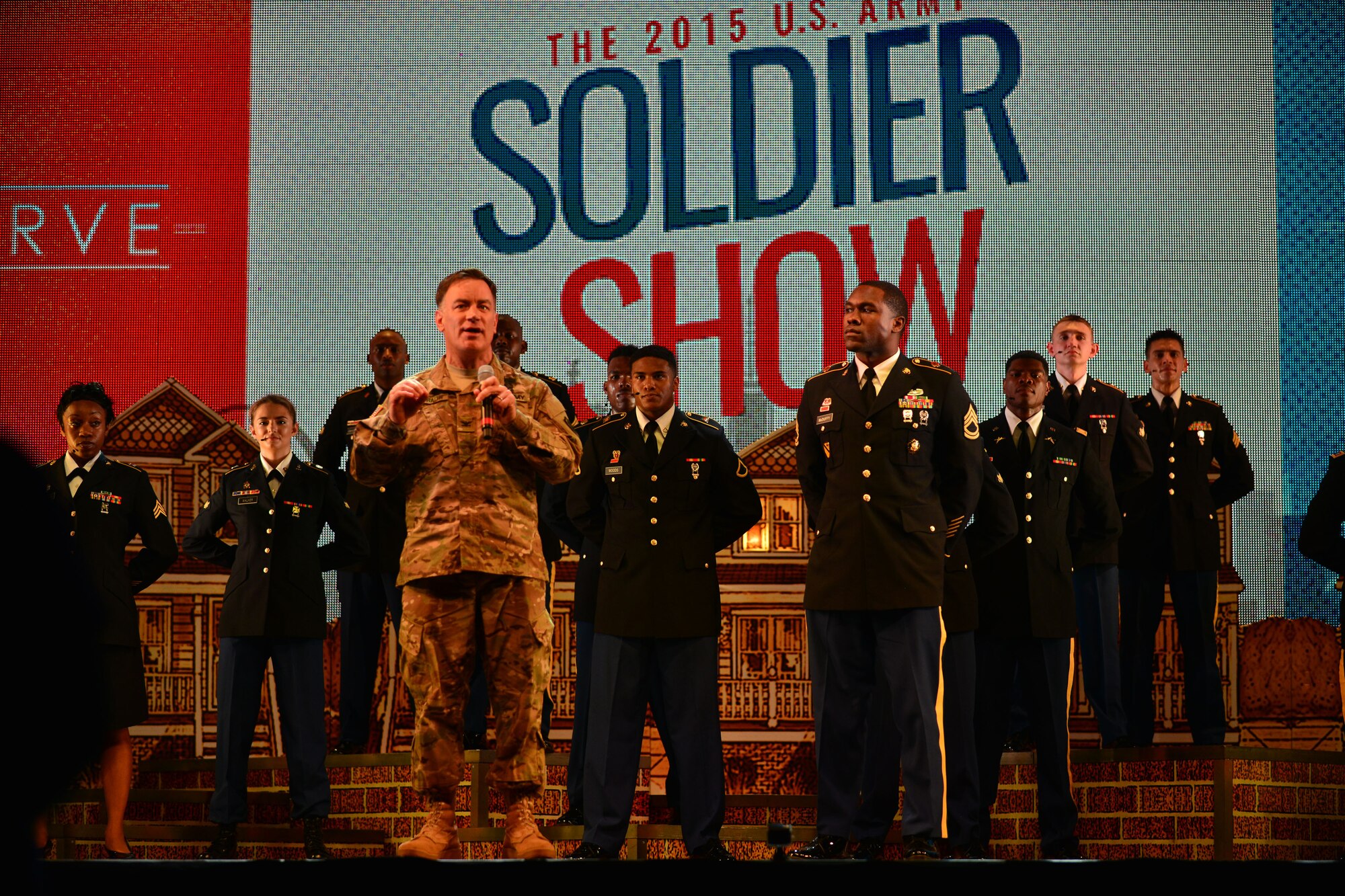 U.S. Army Col. William Galbraith, 733rd Mission Support Group commander, speaks at the end of the U.S. Army Morale Welfare and Recreation Programs Soldier Show performance at Fort Eustis, Va., July 15, 2015. The commander thanked the cast and crew for performing for the Fort Eustis Soldiers and their families, and highlighted the importance of the show and its effect on morale and wellness of Army families. (U.S. Air Force photo by Staff Sgt. Natasha Stannard/Released)