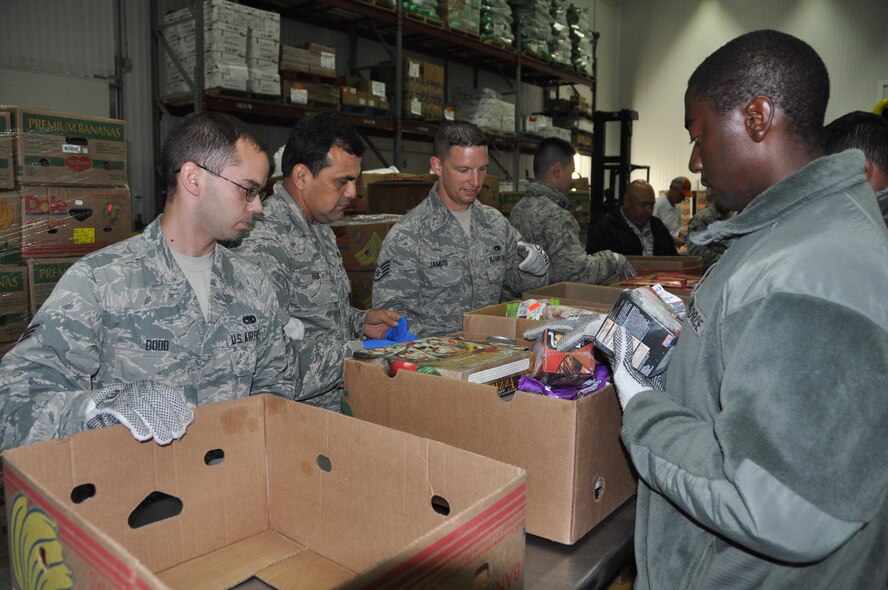 Nearly a dozen 433rd Airlift Wing members from the Aircraft Maintenance Squadron at Joint Base San Antonio-Lackland, Texas separated food items for distribution to local needy families on July 18, 2015, during their block training. The San Antonio Food Bank distributes food items to 16 area food pantries in the South Texas area. (U.S. Air Force photo/Capt. Cris Medina)