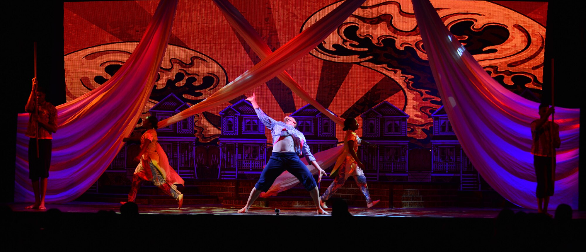 The U.S. Army Morale, Welfare and Recreation Programs Soldier Show dancers perform during a performance at Fort Eustis, Va., July 15, 2015. The Soldier Show travels throughout the country to bring Soldiers and their families morale and welfare education through entertainment. (U.S. Air Force photo by Staff Sgt. Natasha Stannard/Released)