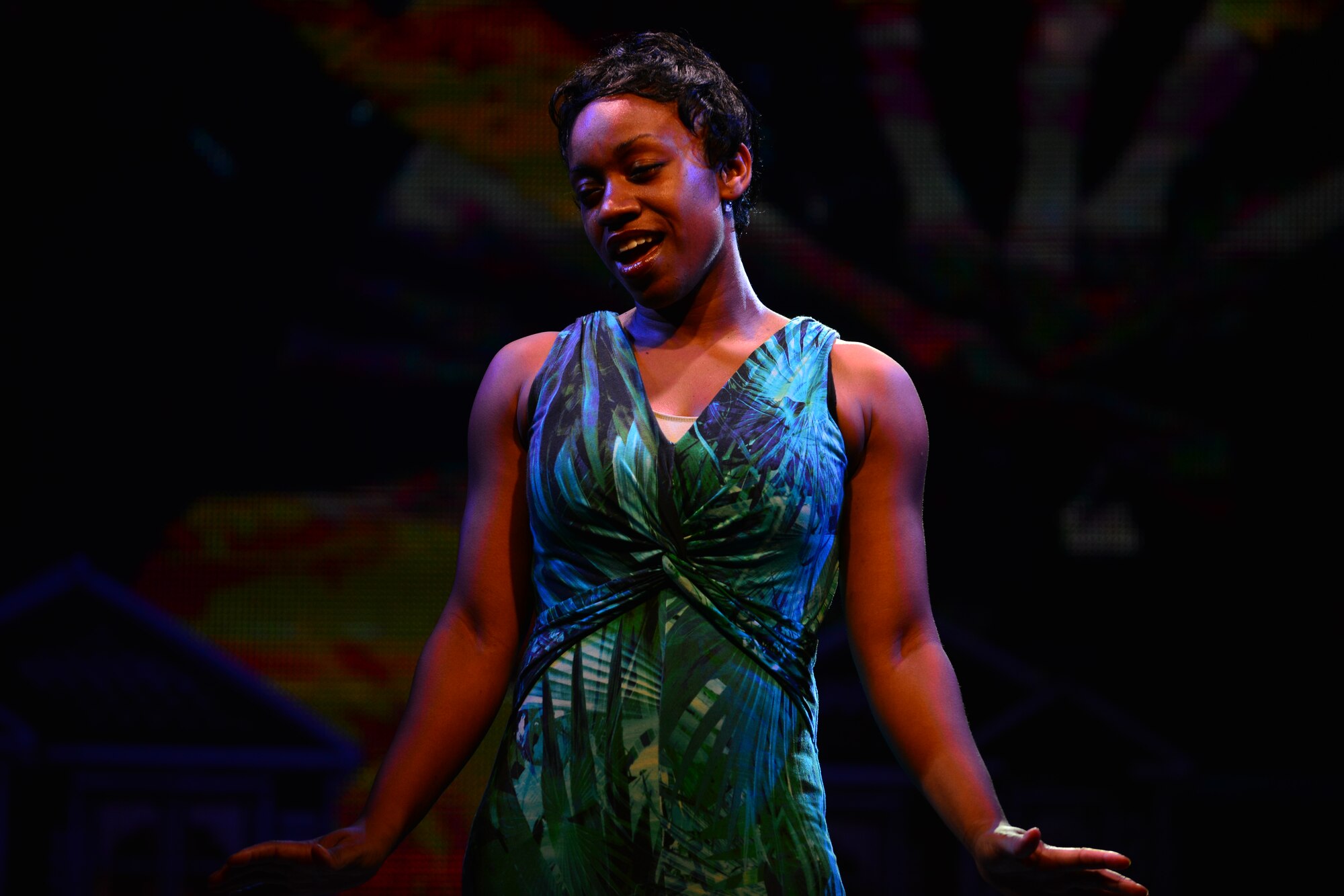 U.S. Army Sgt. Neasha Powell, U.S. Army Morale, Welfare and Recreation Programs Soldier Show performer, sings during a performance at Fort Eustis, Va., July 15, 2015. Powell, a Louisiana Army Reserve Soldier, is on her second tour with the show. (U.S. Air Force photo by Staff Sgt. Natasha Stannard/Released)
