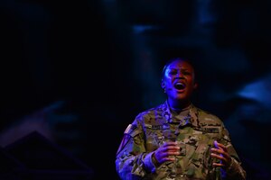 U.S. Army Spc. Tierra Kirts, U.S. Army Morale, Welfare and Recreation Programs Soldier Show performer, sings during a performance at Fort Eustis, Va., July 15, 2015. The 90-minute live musical production showcased the talents of Active-Duty, Reserve and National Guard Soldiers, and highlighted Army family, morale, welfare and recreation programs. (U.S. Air Force photo by Staff Sgt. Natasha Stannard/Released)
