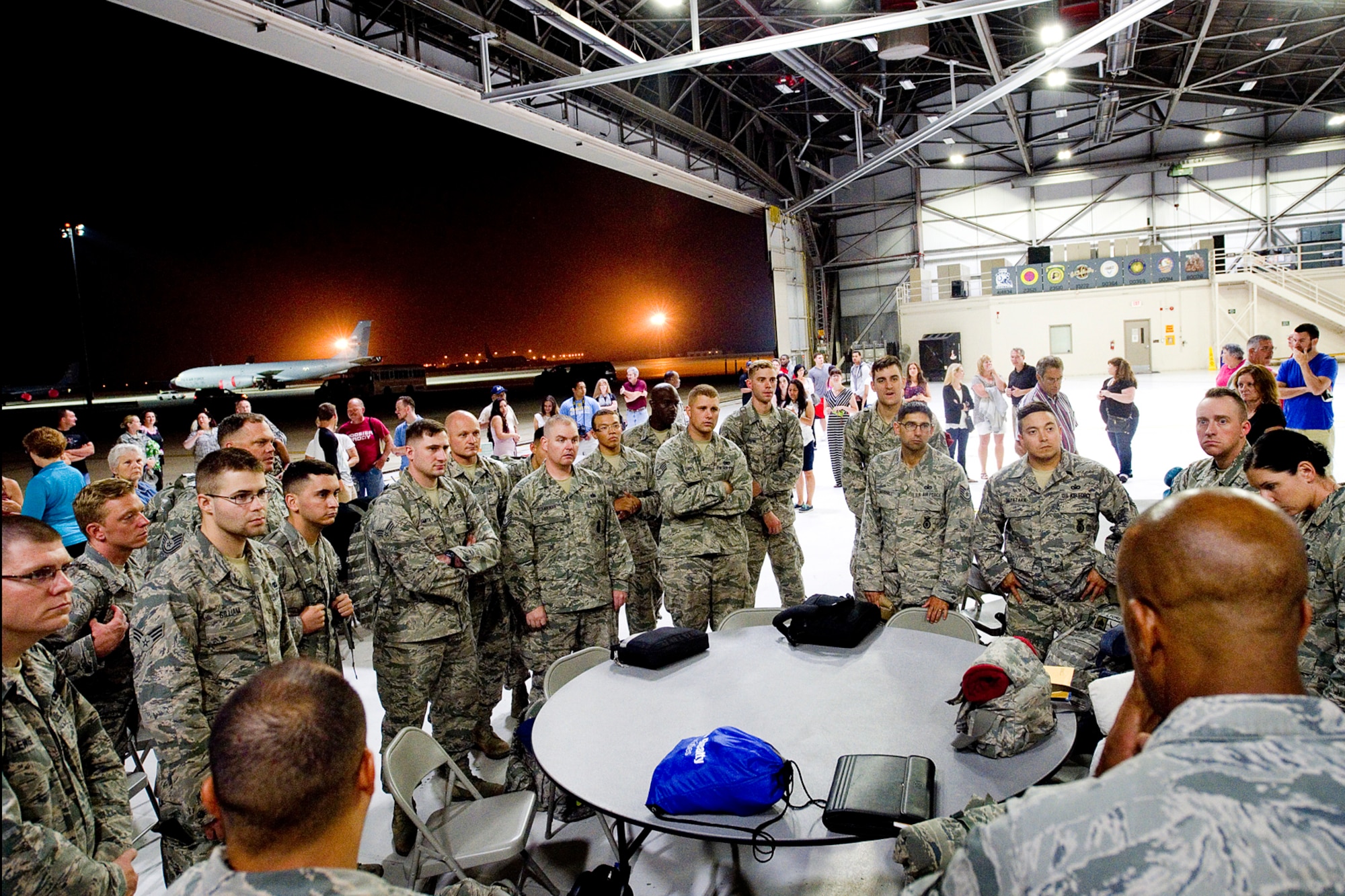 Members of the 434th Security Forces Squadron gather for instructions upon landing at Grissom Air Reserve Base, Ind., July 21, 2015. The defenders returned from a 180-day deployment to Southwest Asia. (U.S. Air Force photo/Tech. Sgt. Douglas Hays)