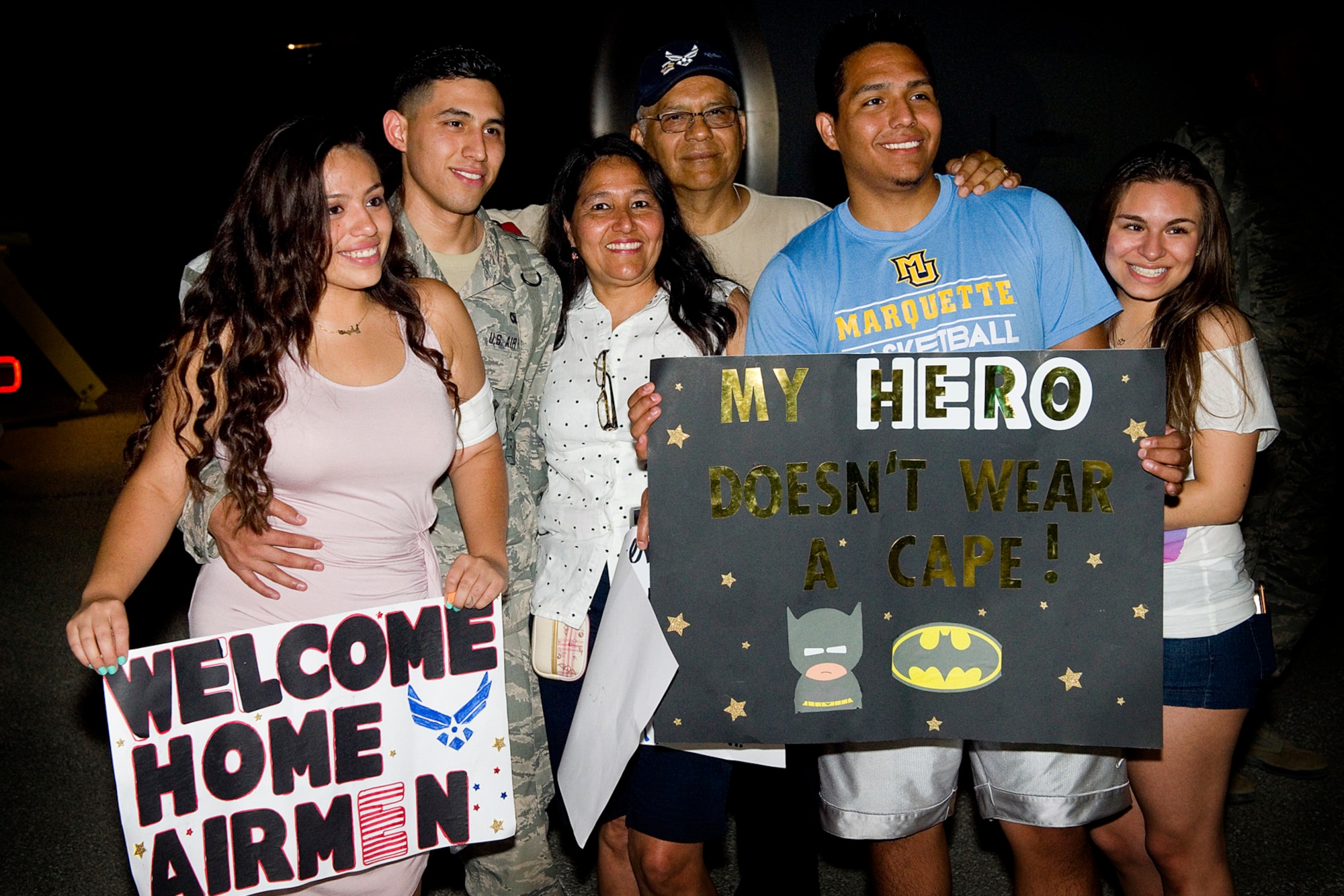 Family and friends of Senior Airman Manuel Paredes, 434th Security Forces fire team member, pose for a photo at Grissom Air Reserve Base, Ind., July 21, 2015. Paredes and 29 other defenders returned from a 180-day deployment to Southwest Asia. (U.S. Air Force photo/Tech. Sgt. Douglas Hays)