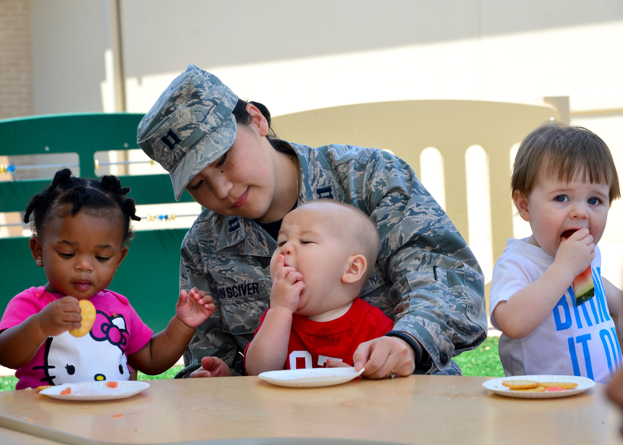 Elijah Van Sciver, son of Capt. Rachel Van Sciver, 373d Training Squadron Detachment 3 commander, eats a piece of watermelon during the Pre Toddler Fun Day July 17, 2015, at the Child Development Center on Dover Air Force Base, Del. The pre toddlers ranged in ages from 1-2 and were served food before participating in various water and outdoor activities on the pre toddler playground. (U.S. Air Force photo/Airman 1st Class William Johnson)