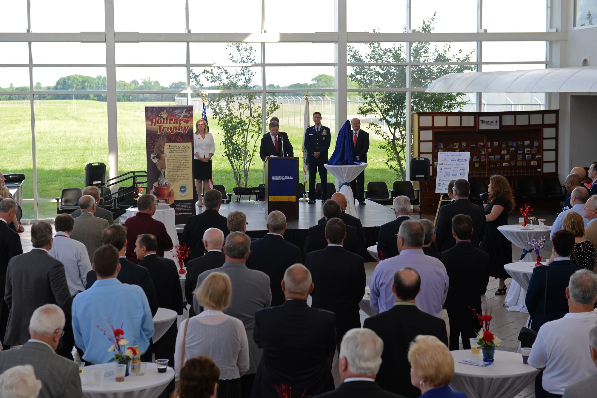 Community and base leaders gather at MidAmerica Airport near Scott Air Force Base and Mascoutah, Illinois, for the Abilene Trophy presentation. It was the second time in three years that the region won the Abilene Trophy in recognition of its support of Scott. (U.S. Air Force photo/Airman 1st Class Erica Holbert-Siebert)