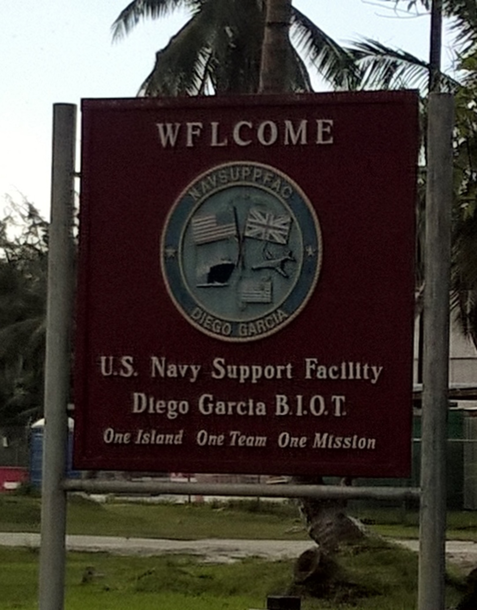 BRITISH INDIAN OCEAN TERRITORIES -- A weather-worn sign greets new arrivals at Diego Garcia, a Navy support facility located on a coral atoll in the British Indian Ocean Territories. The remote location is home to Detachment 2, 21st Operations Group, a geographically separated unit of the 21st Space Wing. (U.S. Air Force photo)