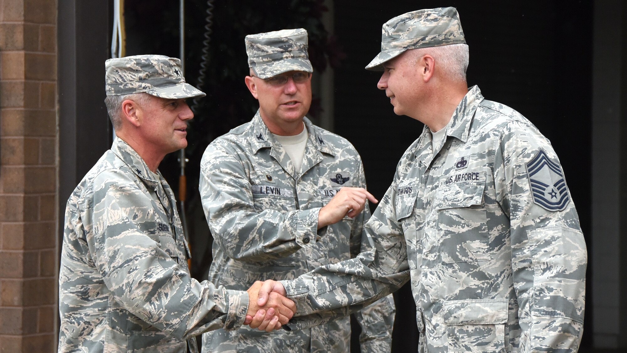 Maj. Gen. Jay Silveria, U.S. Air Force Warfare Center commander, is greeted by Col. Robert J. Levin Jr., 621st Air Mobility Advisory Group commander, and Chief Master Sgt. Kevin P. Edwards, 621st Contingency Response Group superintendent. General Silveria met with members of the U.S. Air Force Expeditionary Center, the 621st Contingency Response Wing and the 57th Weapons Squadron at Joint Base McGuire-Dix-Lakehurst during his visit, July 15, 2015.  (U.S. Air Force photo by Brad Camara)