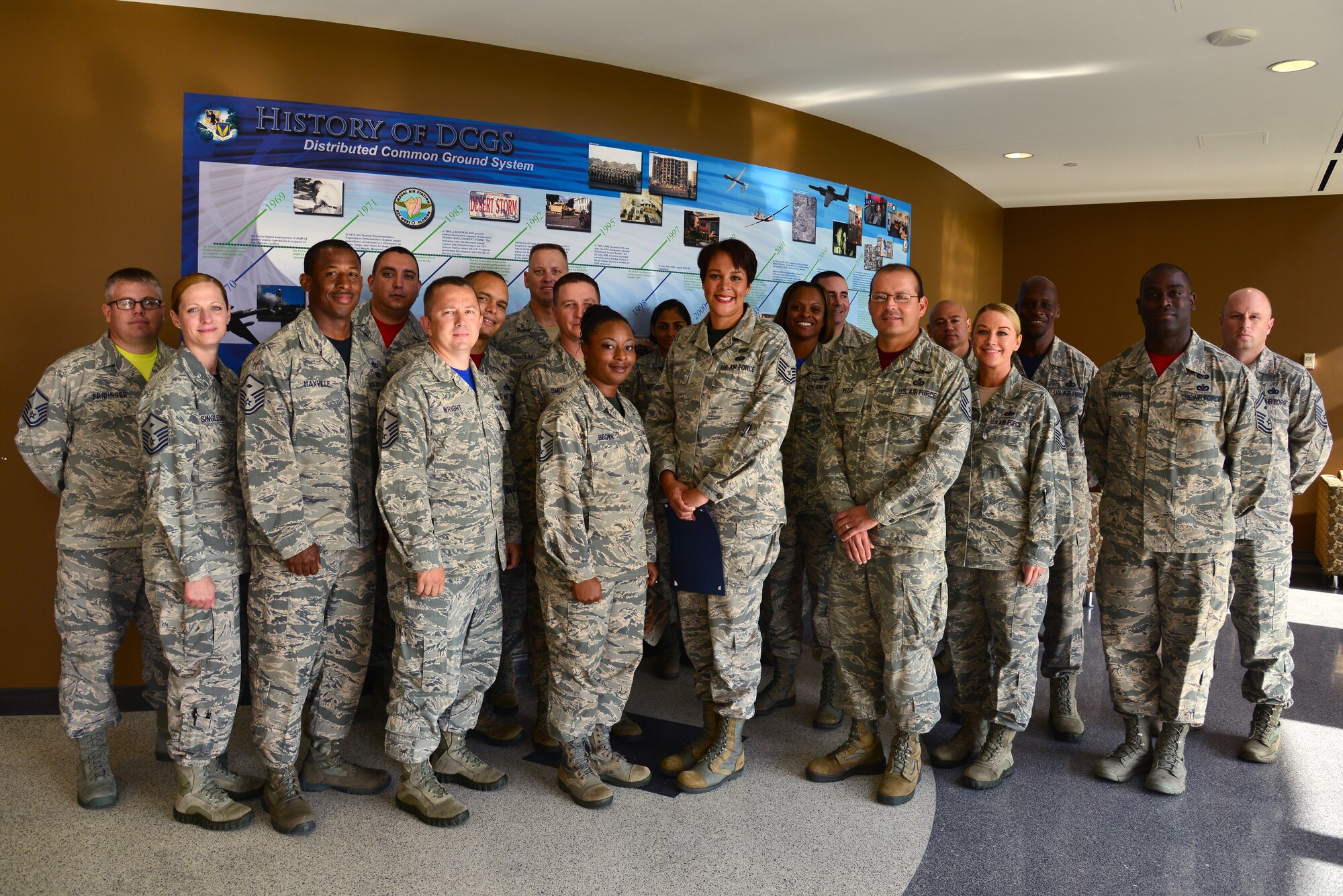 U.S. Air Force first sergeants commend Tech. Sgt. Angie Handy, 440th Supply Chain Operations Squadron equipment and allowance authorization fighter cell lead, for receiving a Diamond Sharp award at Langley Air Force Base, Va., July 17, 2015. Handy brought the challenges of being a single mom working various 12-hour shifts and finding childcare to the attention of her superiors, warranting new childcare services for personnel in similar positions. (U.S. Air Force photo by Senior Airman Aubrey White/Released)