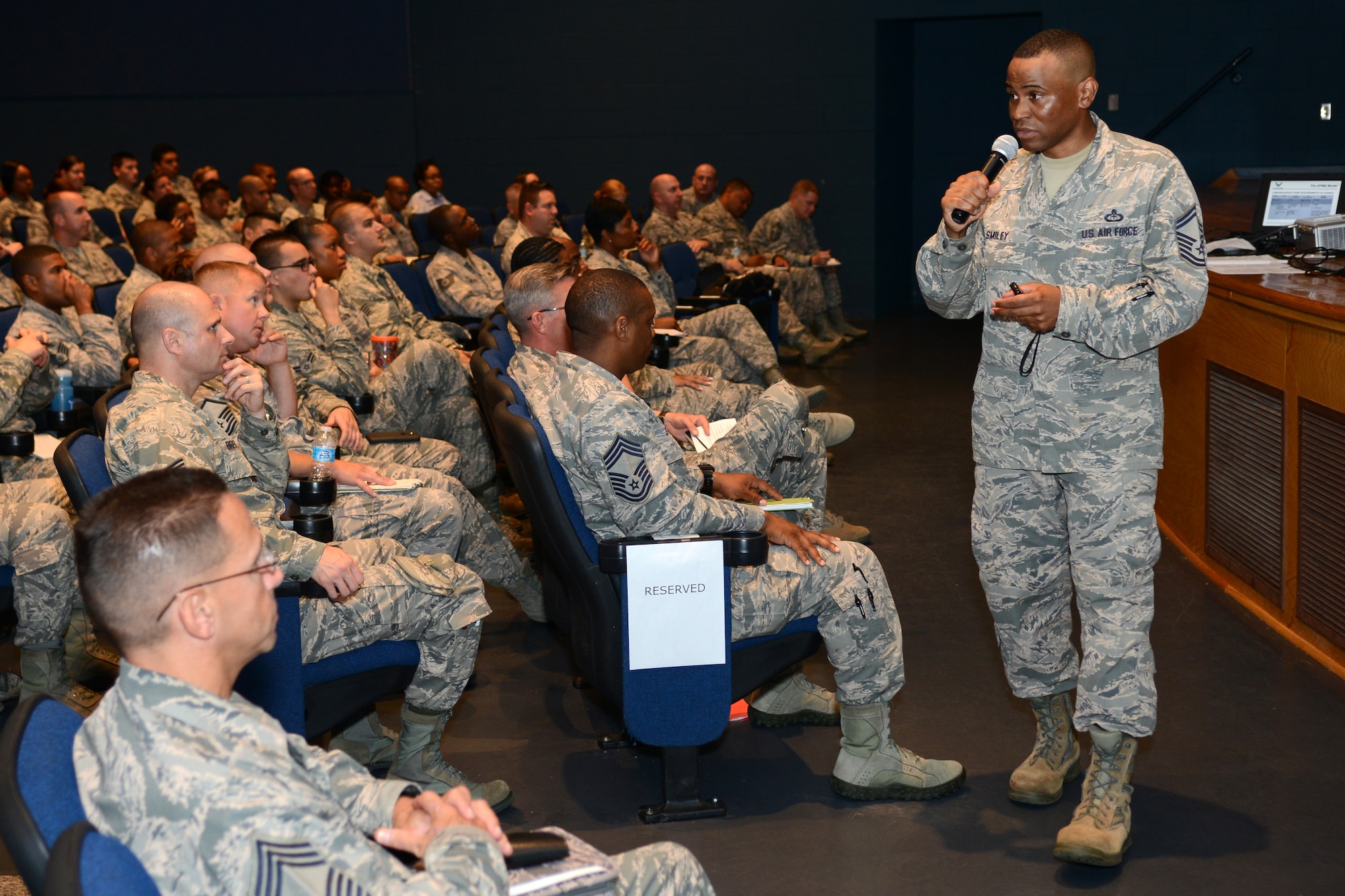 U.S. Air Force Senior Master Sgt. Terrance Smiley, 633rd Air Base Wing career assistance advisor, briefs Airmen about changes to Enlisted Professional Military Education requirements, at Langley Air Force Base, Va., June 24, 2015. The changes, which establish several phases of distance and in-residence learning, affect Airmen in the ranks of senior airman through senior master sergeant. (U.S. Air Force photo by Airman 1st Class Devin S. Michaels/Released)
