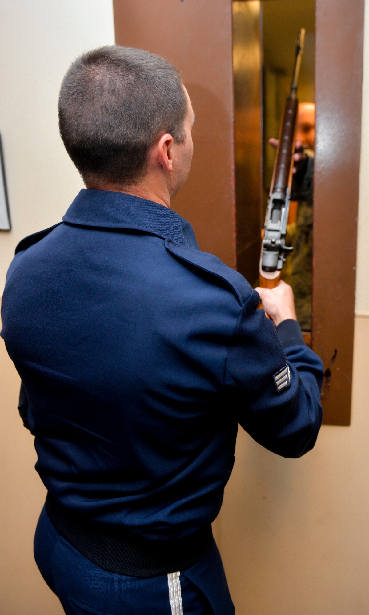 Senior Airman Troy Adams, Barksdale Honor Guard, retrieves a rifle from the 2nd Security Forces Squadron armory prior to a detail on Barksdale Air Force Base, La., July 17, 2015.  Rifles are used with blank ammunition to provide Three-volley salute during the ceremony.  (U.S. Air Force photo/Airman 1st Class Mozer O. Da Cunha)