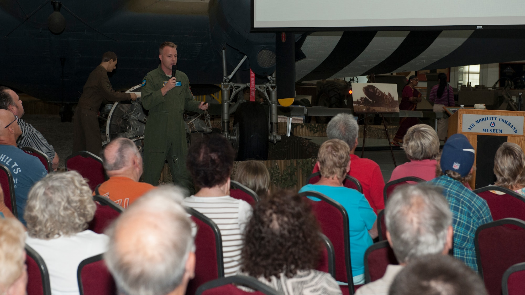 Capt. Travis Doyle, 9th Airlift Squadron C-5M Super Galaxy pilot, gives a presentation entitled, “The Air Force and Airplane Fundamentals,” to an audience July 19, 2015, at the Air Mobility Command Museum on Dover Air Force Base, Del. Doyle is an aircraft commander who flies AMC’s largest aircraft, capable of transporting 285,000 pounds of cargo. (U.S. Air Force photo/Airman 1st Class Zachary Cacicia)
