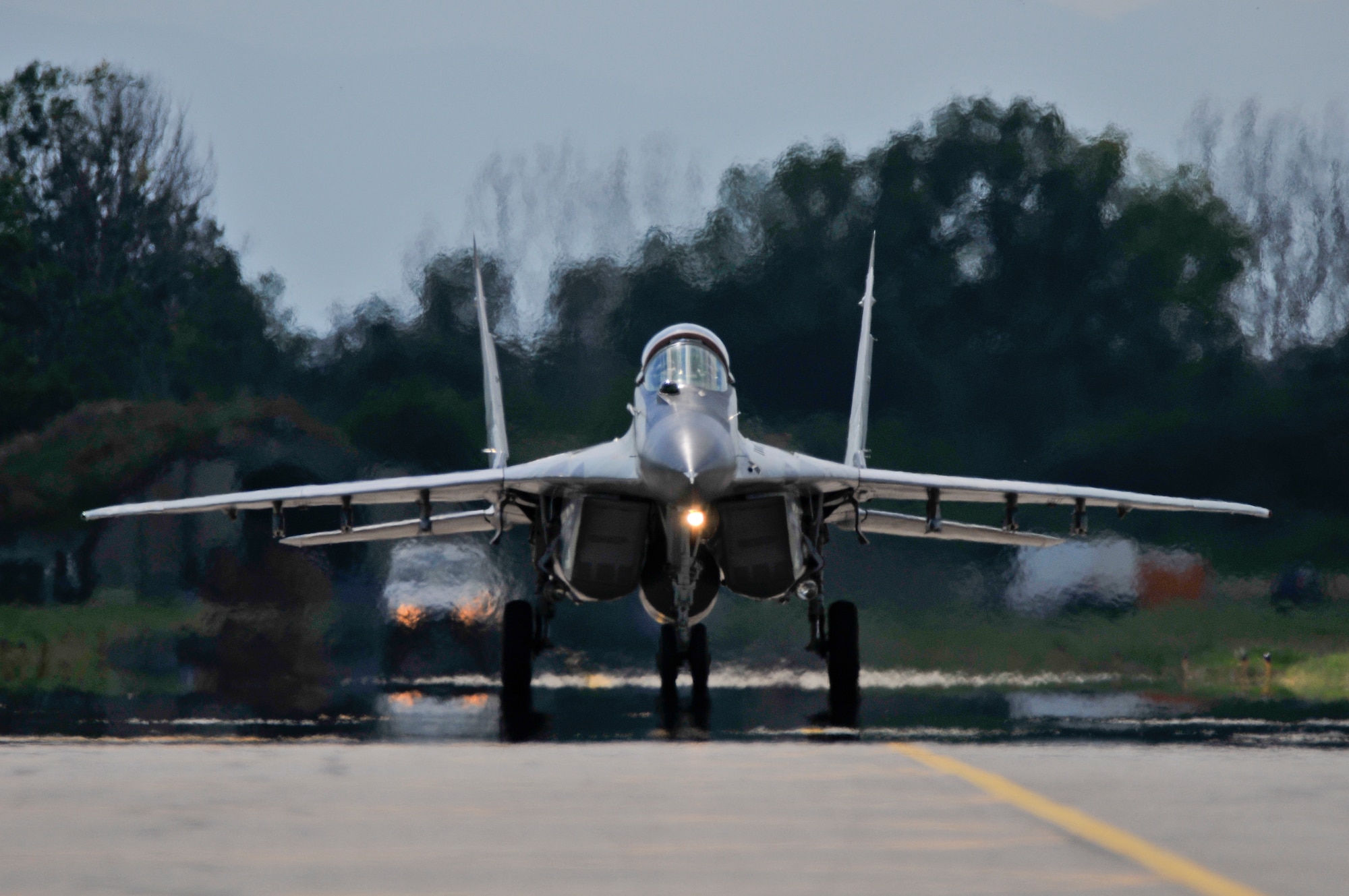 A picture of a Bulgarian air force MiG-29 Fulcrum taxiing back to a ramp.