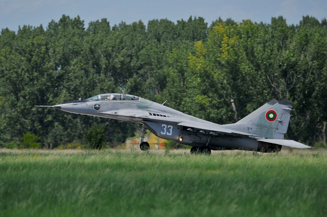 A Bulgarian air force MiG-29 Fulcrum takes off with a U.S. Air Force F-16 pilot from the New Jersey Air National Guard in the back seat for a familiarization flight during Thracian Star at Graf Ignatievo Air Base, Bulgaria, on July 15, 2015. Airmen and F-16s from the 177th Fighter Wing flew sorties with the Bulgarian air force in the bilateral training exercise, designed to enhance interoperability. Some MiG-29, MiG-21 and F-16 pilots from each country were afforded the opportunity to fly in each other's jets and observe their capabilities. (U.S. Air National Guard photo by Master Sgt. Andrew J. Moseley/Released)