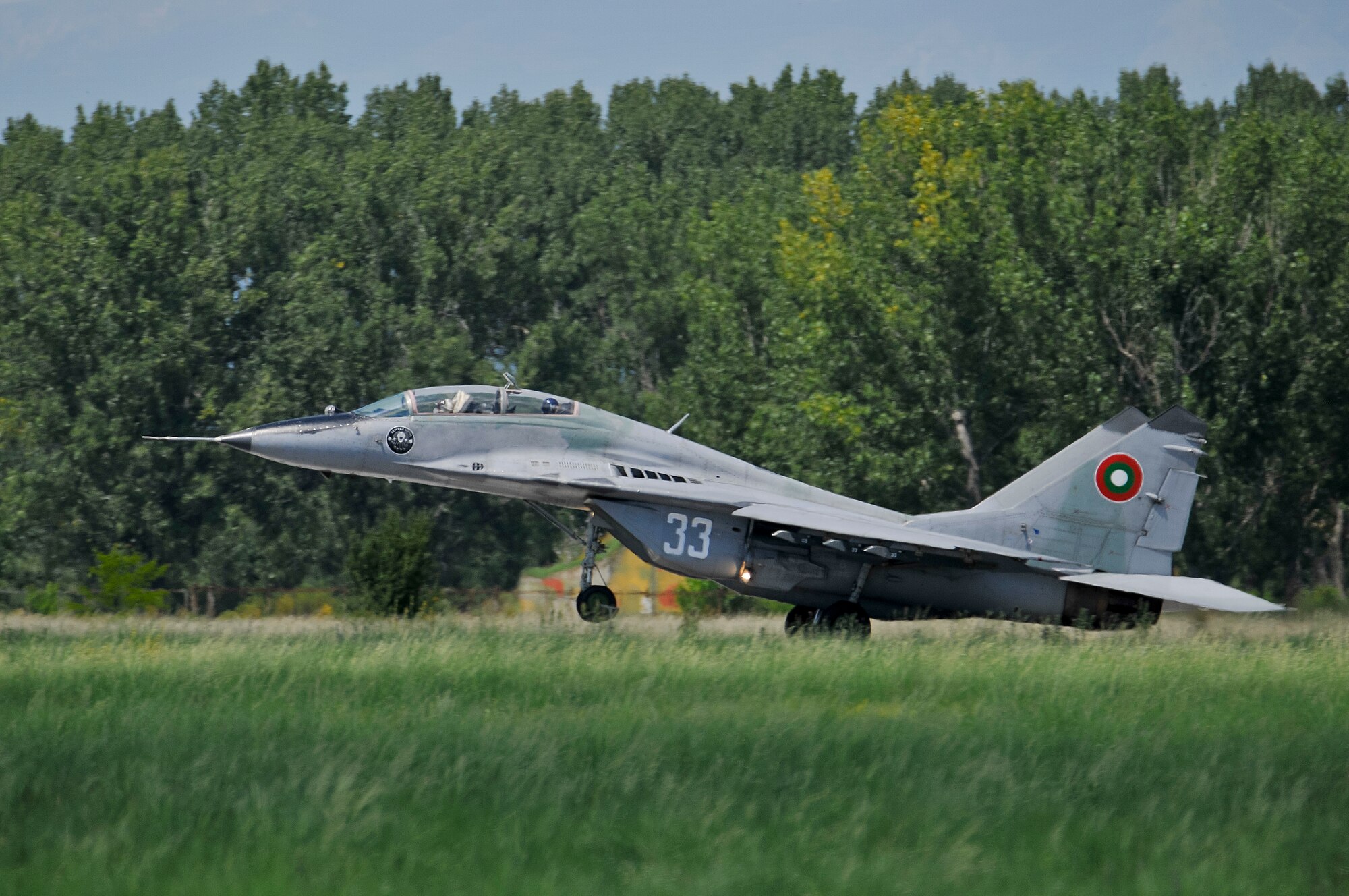 A picture of a Bulgarian air force MiG-29 Fulcrum taking off with a U.S. Air Force F-16 pilot in the back seat.