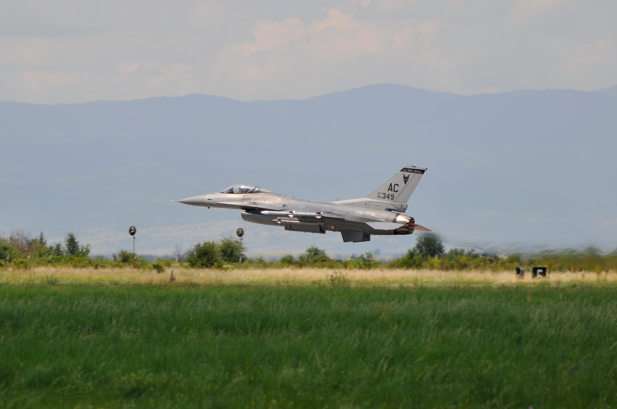 A picture of a U.S. Air Force F-16C Fighting Falcon taking off from a runway.