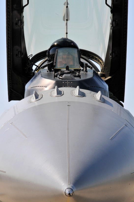 U.S. Air Force Lt. Col. Philippe Malebranche, F-16 pilot with the 177th Fighter Wing, prepares to start the turbine engine, close the canopy and taxi his Fighting Falcon to take off on a training mission during Thracian Star, a bilateral training exercise to enhance interoperability with the Bulgarian air force, at Graf Ignatievo Air Base, Bulgaria, on July 13, 2015. (U.S. Air National Guard photo by Master Sgt. Andrew J. Moseley/Released)