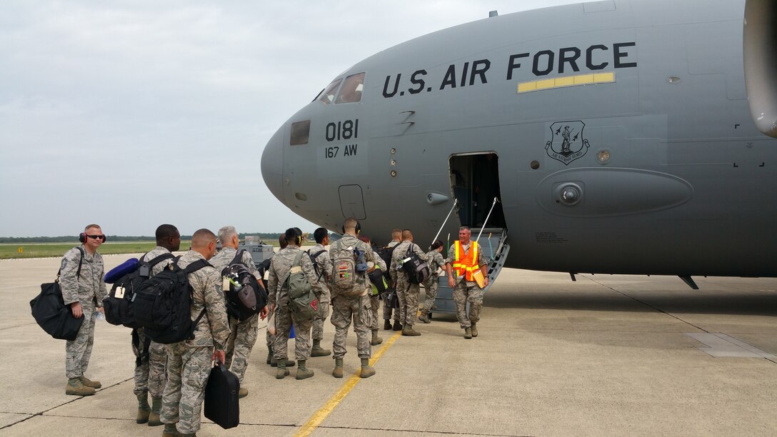 U.S. Air Force Airmen, from the 177th Fighter Wing of the New Jersey Air National Guard, board a West Virginia ANG C-17 Globemaster III at Atlantic City International Airport, N.J., on July 13, 2015, to travel to Thracian Star, a bilateral training exercise to enhance interoperability with the Bulgarian air force at Graf Ignatievo Air Base, Bulgaria. (U.S. Air National Guard photo by Master Sgt. Andrew J. Moseley/Released)