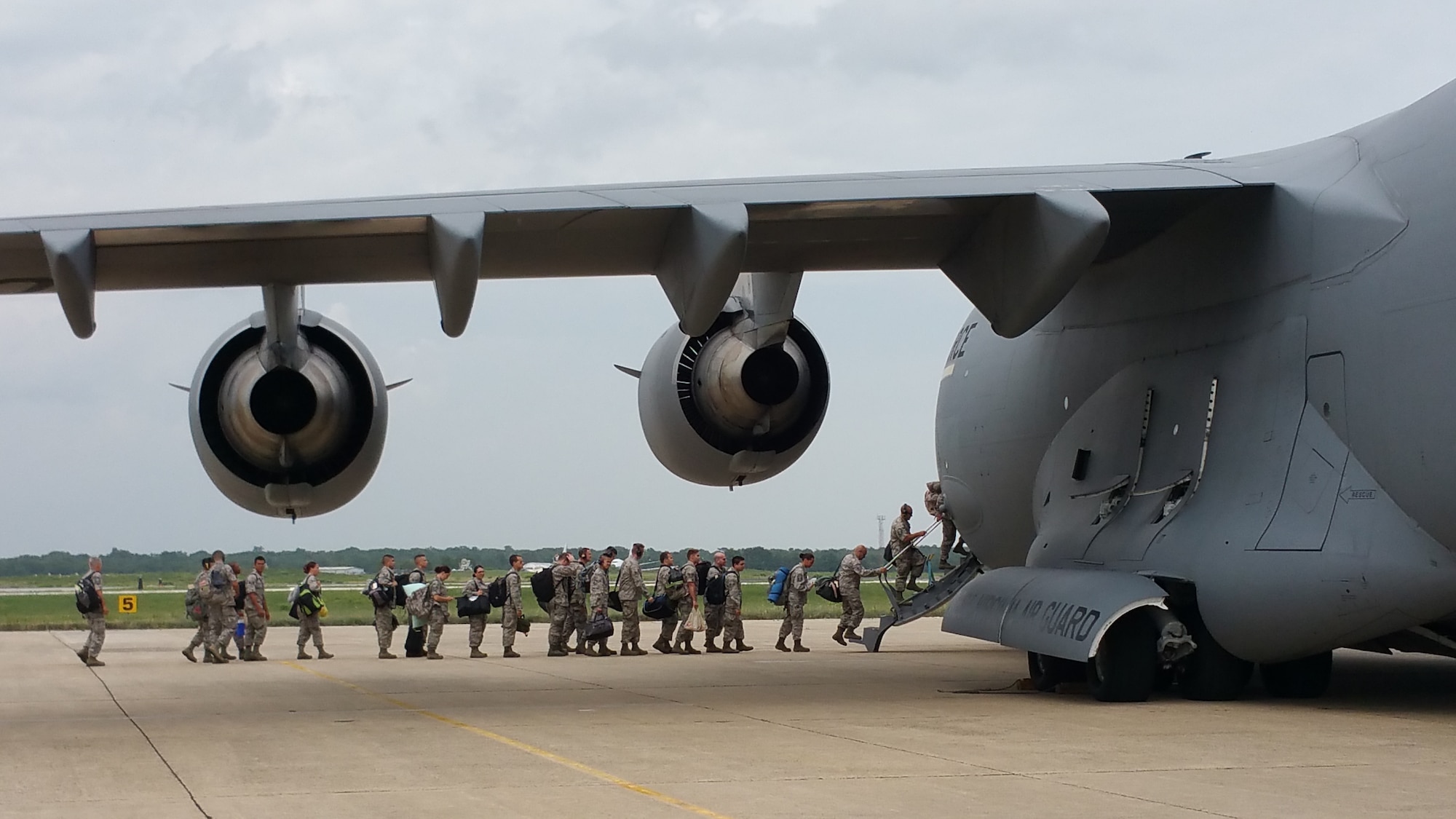 A picture of U.S. Air Force Airmen boarding a West Virginia ANG C-17 Globemaster III.