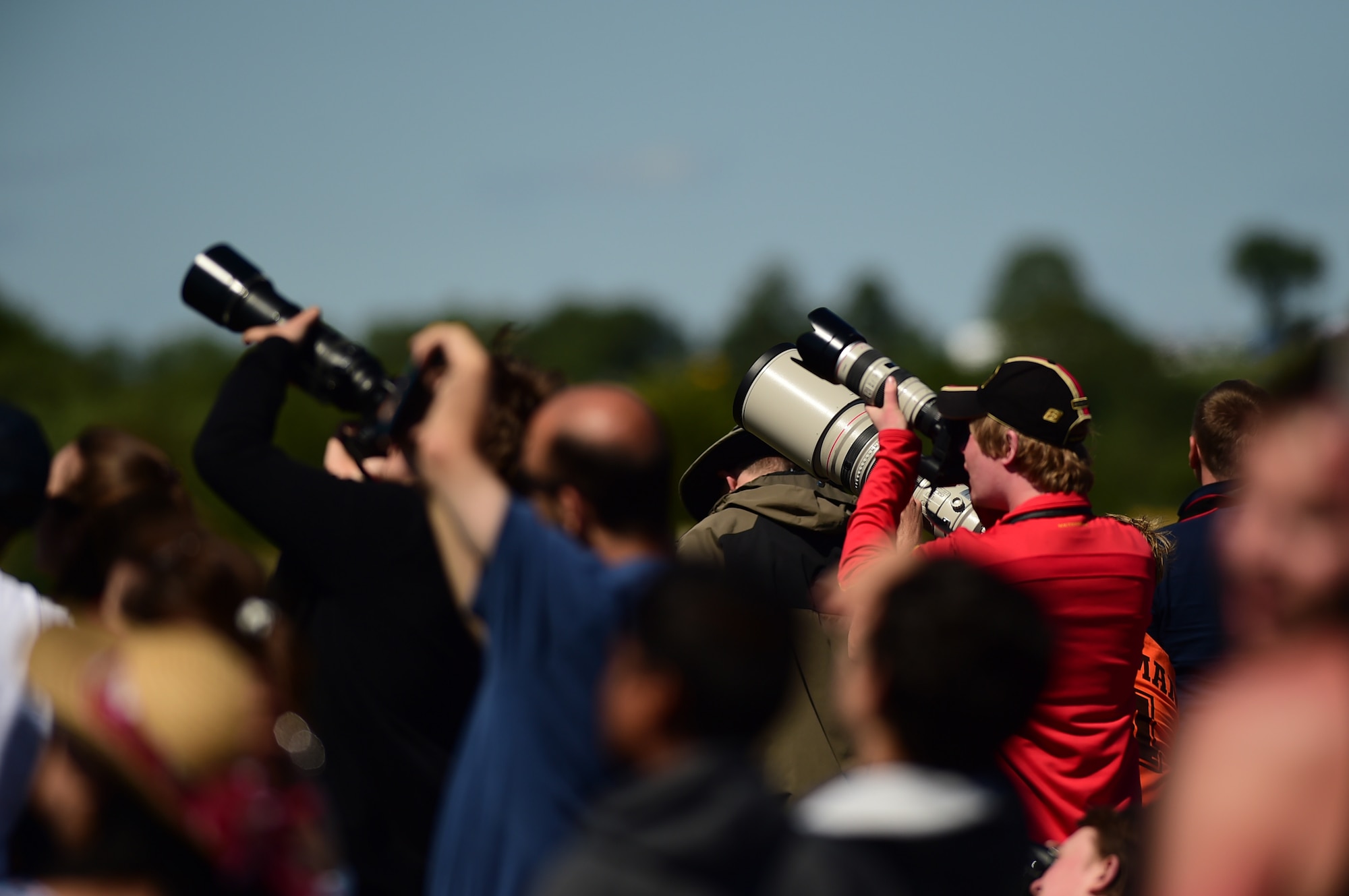 Crowds photograph the aerial displays during the Royal International Air Tattoo at RAF Fairford, United Kingdom, July 19, 2015. Approximately 150,000 aviation fans enjoyed RIAT’s 30th year, where 250 aircraft from 16 countries participated in the three day at largest military airshow in the world. (U.S. Air Force photo by Tech. Sgt. Chrissy Best/Released)