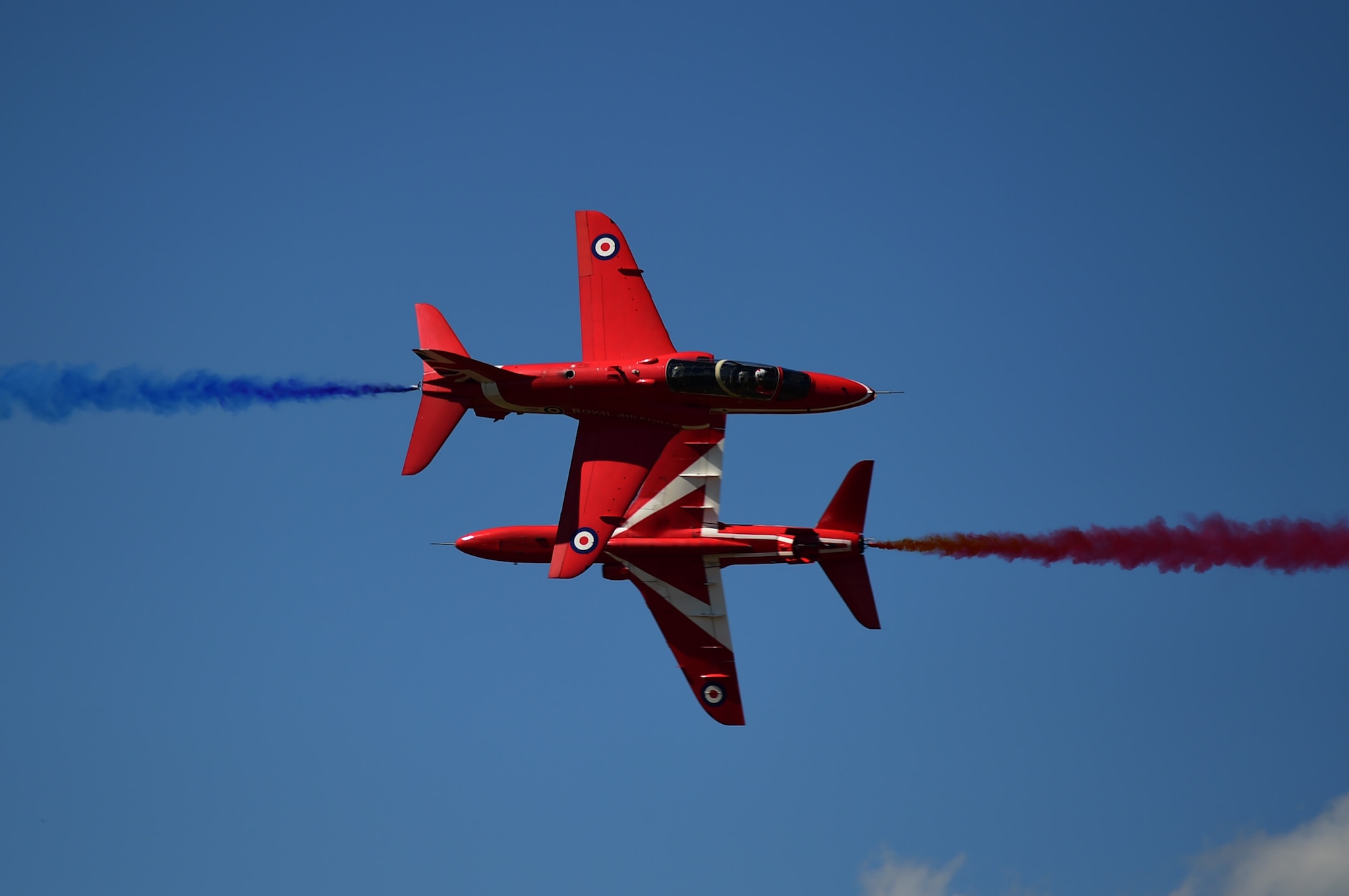 The Royal Air Force Red Arrows aerobatic team performs during the Royal International Air Tattoo at RAF Fairford, United Kingdom, July 19, 2015. The Red Arrows were established in 1965, and are in their 51st display season, performing in approximately 4,500 public displays. (U.S. Air Force photo by Tech. Sgt. Chrissy Best/Released)