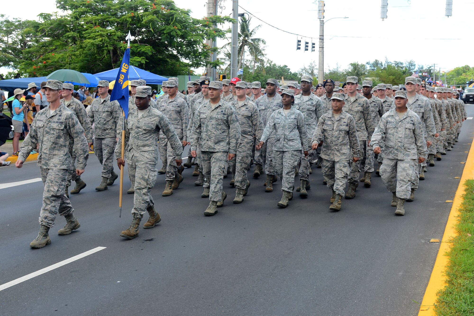 Airmen from Andersen Air Force Base march in the Liberation Day Parade July 21, 2015, in Hagåtña, Guam. Formations of active-duty service members, guardsmen and reservists, including more than 100 Airmen from the 36th Wing, marched in the parade down the 1.2-mile route past thousands of spectators. (U.S. Air Force photo by Airman 1st Class Alexa Ann Henderson/Released)