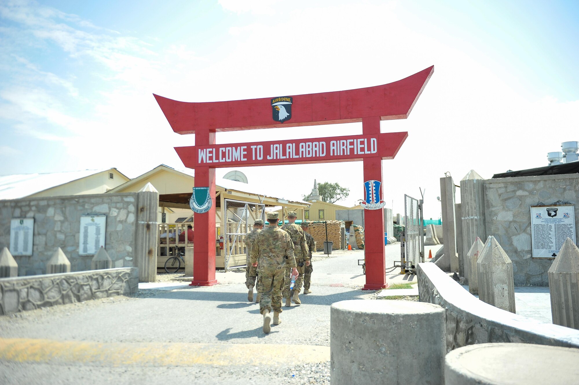 Entrance sign to the main base at Jalalabad Airfield, Afghanistan. U.S. Air Force Brig. Gen. Dave Julazadeh, 455th Air Expeditionary Wing commander, and Chief Master Sgt. Matt Grengs, 455th Air Expeditionary Wing command chief, visited Jalalabad Airfield July 20, 2015, as part of a battlefield circulation tour to see Airmen and get updated on the ongoing mission at the remote airfield. The 62nd Expeditionary Reconnaissance Squadron, Detachment 1 is a geographically-separated unit of the 451st Air Expeditionary Group at Kandahar Airfield. (U.S. Air Force photo by Maj. Tony Wickman/Released)