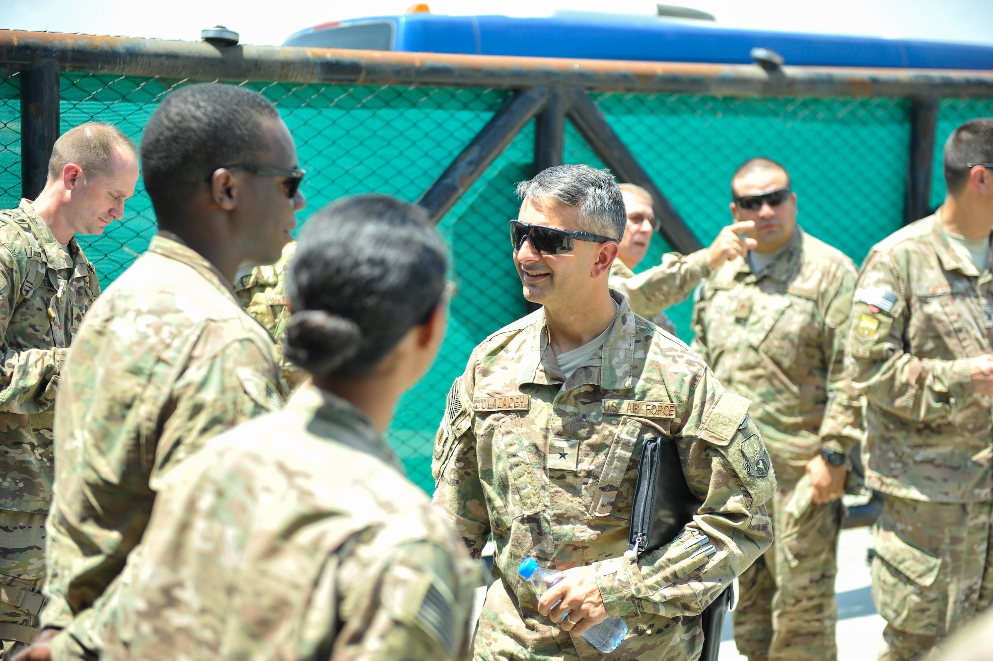 U.S. Air Force Brig. Gen. Dave Julazadeh, 455th Air Expeditionary Wing commander, visits with 62nd Expeditionary Reconnaissance Squadron, Detachment 1 members at Jalalabad Airfield, Afghanistan, July 20, 2015. Julazadeh and Chief Master Sgt. Matt Grengs, 455th AEW command chief, visited JAF as part of a battlefield circulation tour to see Airmen and get updated on the ongoing mission at the remote airfield. The 62nd ERS, Detachment 1 is a geographically-separated unit of the 451st Air Expeditionary Group at Kandahar Airfield. (U.S. Air Force photo by Maj. Tony Wickman/Released)