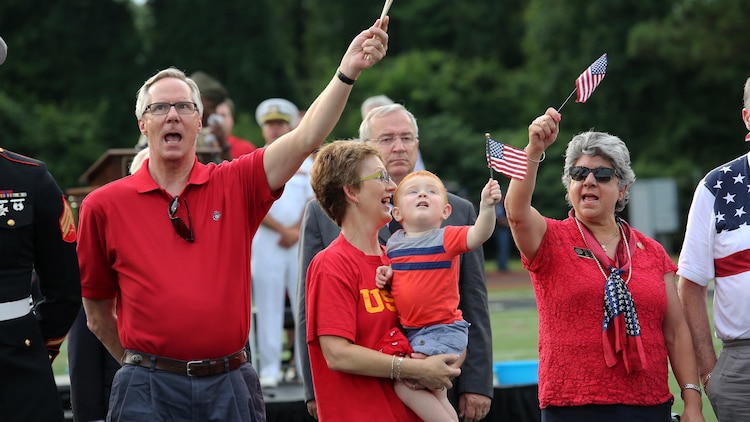 Marines, family, friends and community members all gathered together to sing “God Bless America” at Lance Cpl. Squire Wells memorial at Sprayberry High School in Marietta, Georgia, July 21, 2015. Wells was one of the five military members killed by a gunman at the Naval Operational Support Center and Marine Corps Reserve Center in Chattanooga, Tennessee. Those closest to Wells remember him not only as a dedicated Marine but as a young man with contagious enthusiasm and a dedicated loving son.