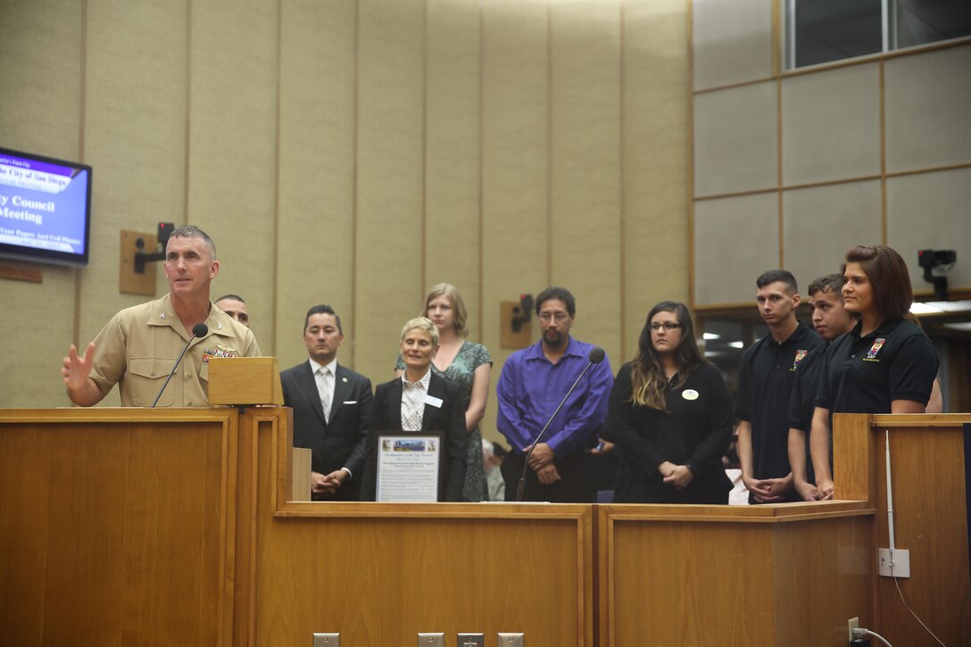 Col. John Farnam, commanding officer of Marine Corps Air Station Miramar, California, speaks to the council on behalf of the MCAS Miramar Single Marine Program at the City Administration Building, San Diego, July 21. The SMP received recognition for contributing more than 300 hours of volunteer effort to the city of San Diego. (U.S. Marine Corps photo by Lance Cpl. Kimberlyn Adams/Released)