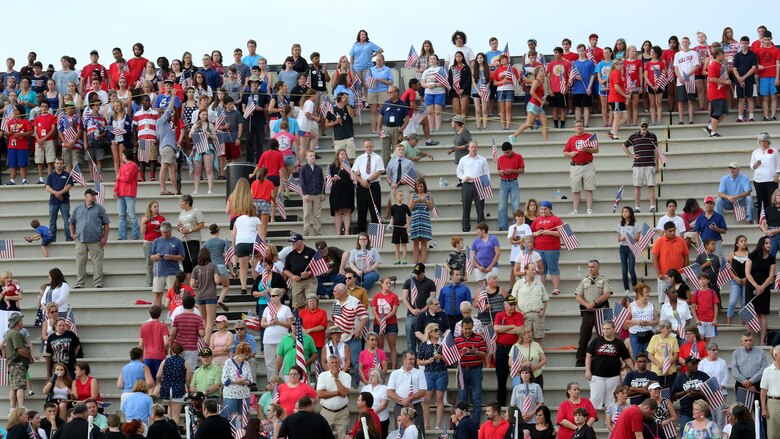 Community members poured into the Sprayberry High School stadium to attend Lance Cpl. Squire Wells memorial on July 21, 2015. Wells is one of the five service members killed during an attack by a gunman at the Naval Operational Support Center and Marine Corps Reserve Center in Chattanooga, Tennessee on July 16, 2015. Wells was honored and remembered at the memorial as a dedicated Marine and loving son.