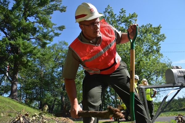 BRAINERD, Minn. – Robert Burns, Gull Lake Recreation Area summer ranger, picks up debris following a July 12 storm that dropped nearly 1,000 trees. The park, on the southeast side of Gull Lake and near Brainerd, Minnesota, had campers at 26 campsites when the storm arrived around 7 p.m. Despite damage to a few vehicles and buildings, there were no injuries to any of the staff of campers.