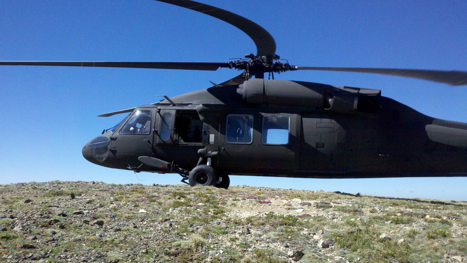 A Colorado Army National Guard UH-60 Black Hawk helicopter from the High-altitude Army National Guard Aviation Training Site (HAATS) in Gypsum, Colo., lands on the summit of Missouri Mountain to transport rescuers to the scene where a father and daughter hiking team went missing June 28.