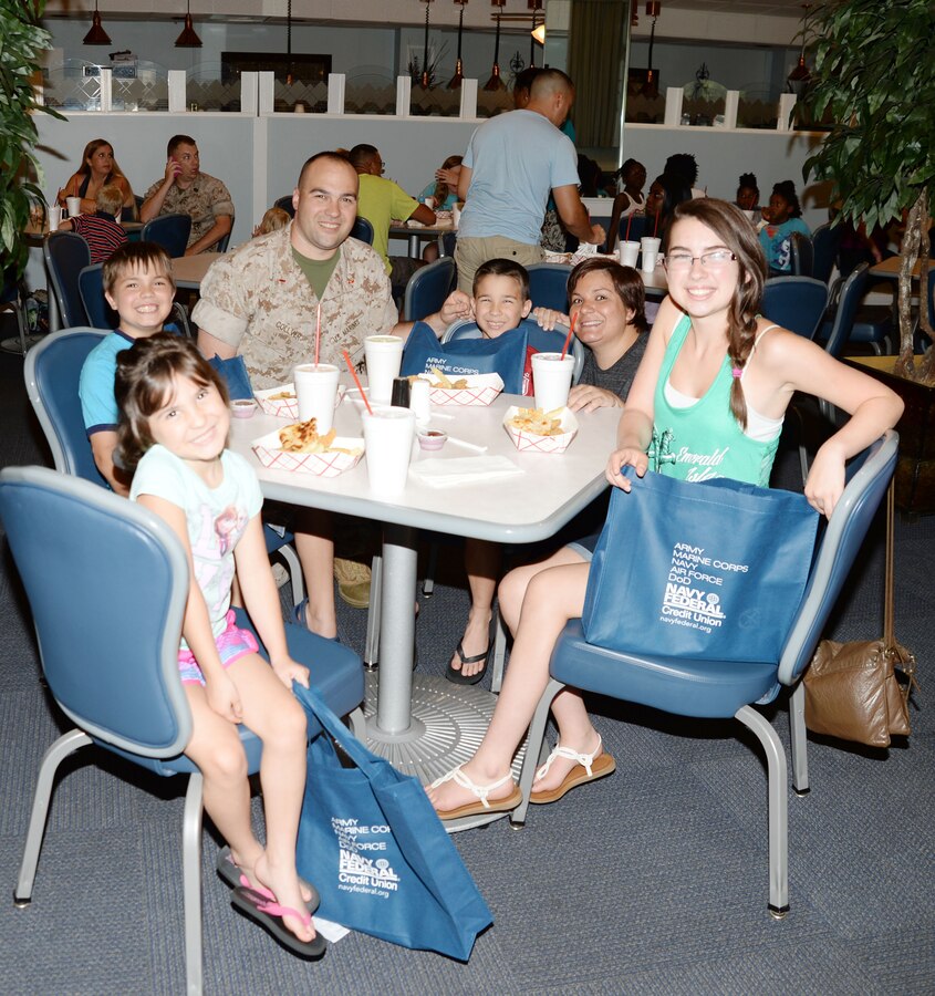 Military families take advantage of the opportunity to network with area school administrators during the installation’s Operation Tools for School event at the Town and Country Restaurant Grand Ballroom, July 21. The activity, which was hosted by Marine Corps Community Services staff at Marine Corps Logistics Base Albany, was designed to kick off the academic school year and to  provide a chance  for active-duty service members, their spouses and children to obtain relevant information from local and neighboring counties’ school systems representatives. Students were given school supplies and a toy at the event.