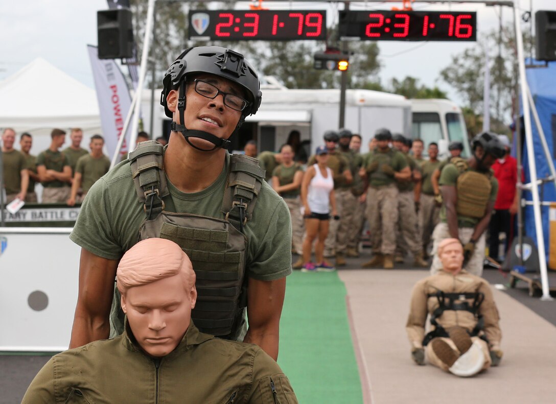 Marines and Sailors competed in the Military Battle Challenge, Commanding General’s Cup competition at the 11 Area shopping center, July 22. Competitors raced to complete a series of tasks such as scaling a rope net, moving five 40lb. fuel canisters and shooting laser guns. The Military Battle Challenge is a new obstacle course race that tests competitor’s endurance, strength and marksmanship skills against the clock and each other.