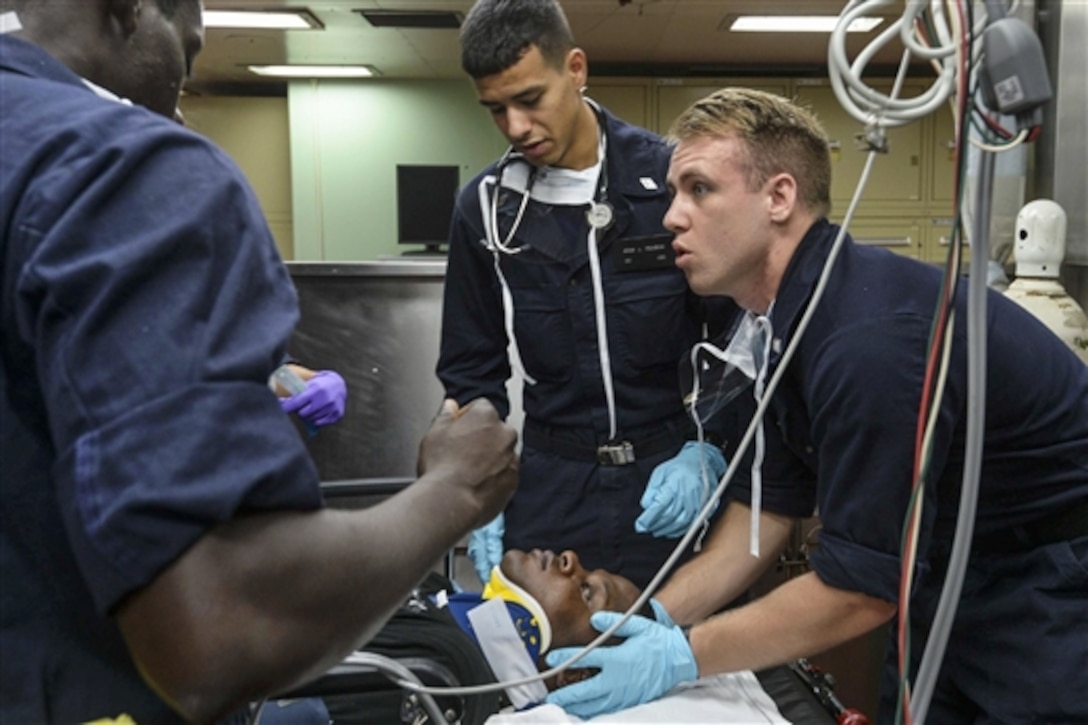 Crew members on board the hospital ship USNS Mercy conduct a mass-casualty drill during Pacific Partnership 2015 in the Philippine Sea, July 16, 2015. Medical personnel trained at various stations, focusing on skills for reception and initial treatment of a mass-casualty scenario. While training for crisis conditions, Pacific Partnership missions have provided medical care to about 270,000 patients, and veterinary services to more than 38,000 animals. 