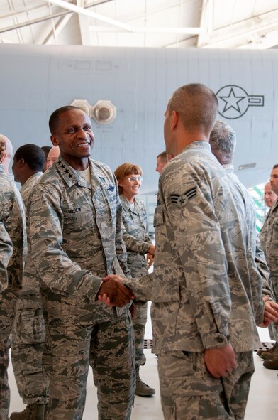 Gen. Darren W. McDew, Air Mobility Command commander, left, thanks Senior Airman Robert Cento, crew chief from the 108th Maintenance Group, New Jersey Air National Guard,  for working hard to maintain quality aircraft at Joint Base McGuire-Dix-Lakehurst, N.J., July 22, 2015. McDew visited the wing to meet with Air Mobility Airmen to discuss the current and future flying platforms of the Air National Guard. (U.S. Air National Guard photo by Airman 1st Class Julia Pyun)